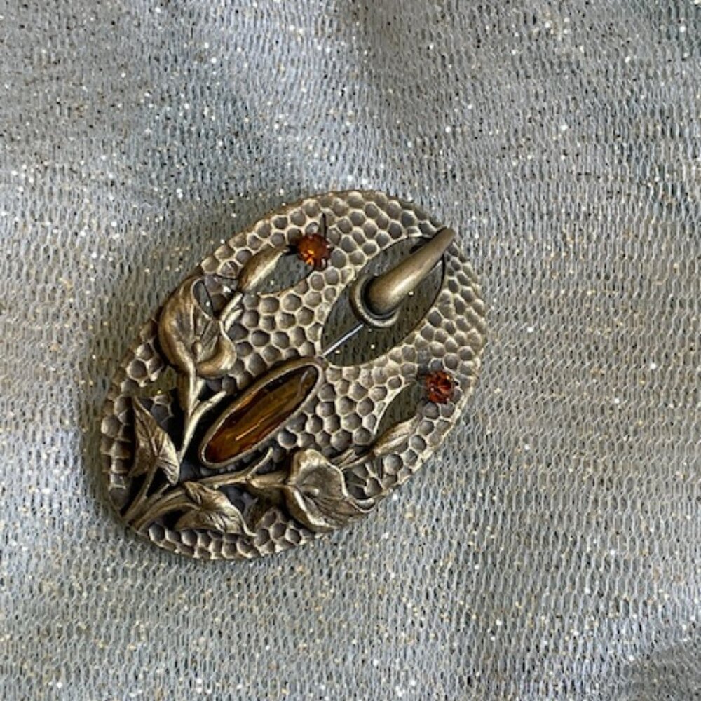 Vintage bronze brooch, raised lily pattern, amber stones, excellent condition